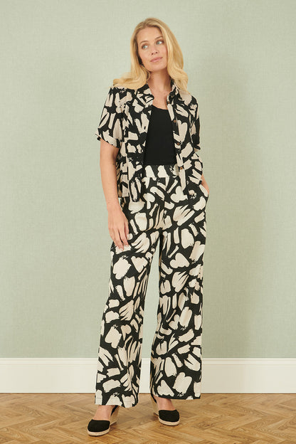 Yumi Black Cotton Splash Print Relaxed Fit Trousers – product image 1 of 4