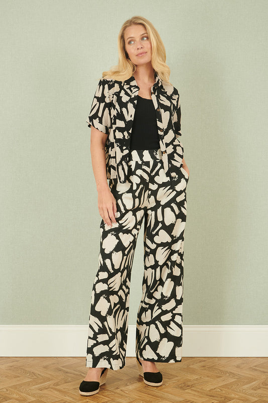 Yumi Black Cotton Splash Print Relaxed Fit Trousers – product image 1 of 4
